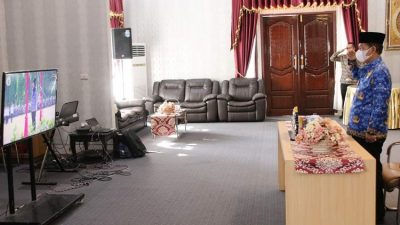 Bupati Lampura Ikuti Upacara Harkitnas Tahun 2022 Secara Virtual